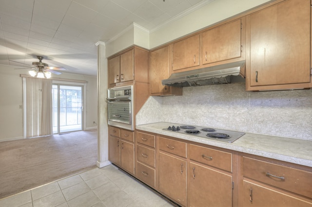 kitchen featuring oven, light colored carpet, stainless steel electric stovetop, ceiling fan, and tasteful backsplash