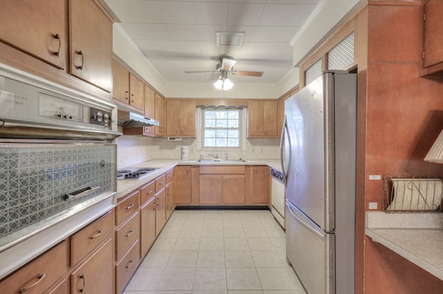 kitchen featuring ornamental molding, white appliances, backsplash, ceiling fan, and light tile patterned flooring