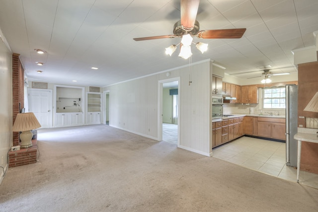 interior space featuring stainless steel refrigerator, ceiling fan, decorative backsplash, and light carpet