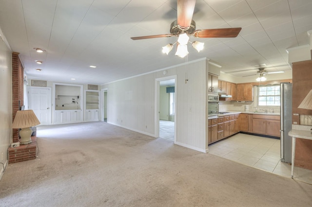 unfurnished living room featuring ornamental molding, light tile patterned flooring, built in features, and light colored carpet