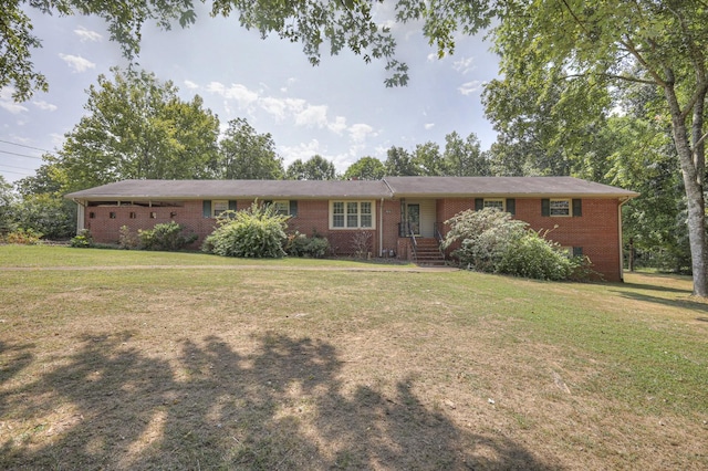 ranch-style home featuring brick siding and a front yard