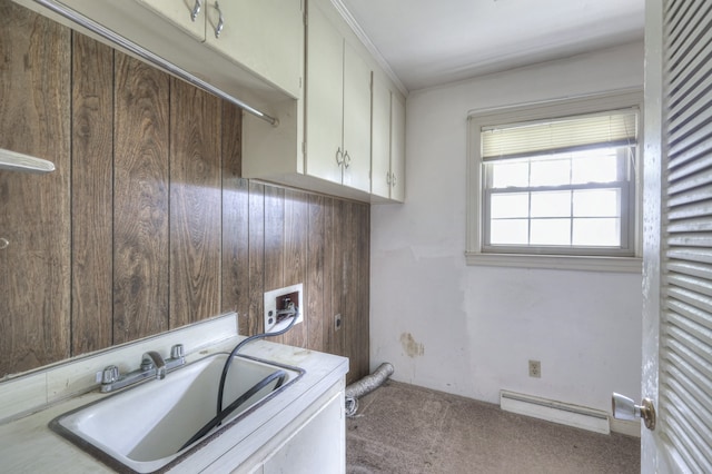 laundry room with cabinets, washer hookup, sink, carpet flooring, and a baseboard heating unit