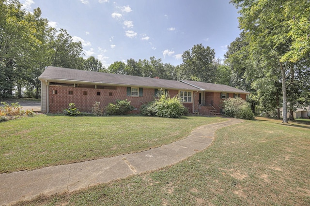 single story home with brick siding and a front lawn