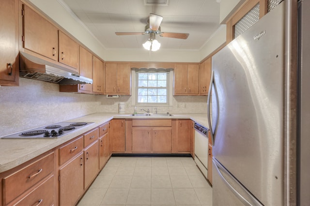 kitchen with light tile patterned floors, white appliances, sink, ceiling fan, and decorative backsplash