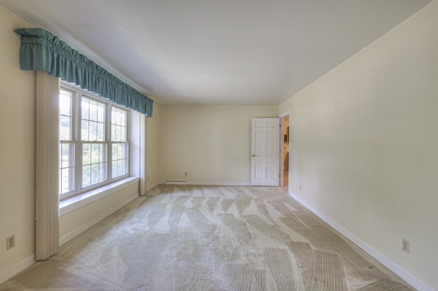 carpeted empty room with plenty of natural light