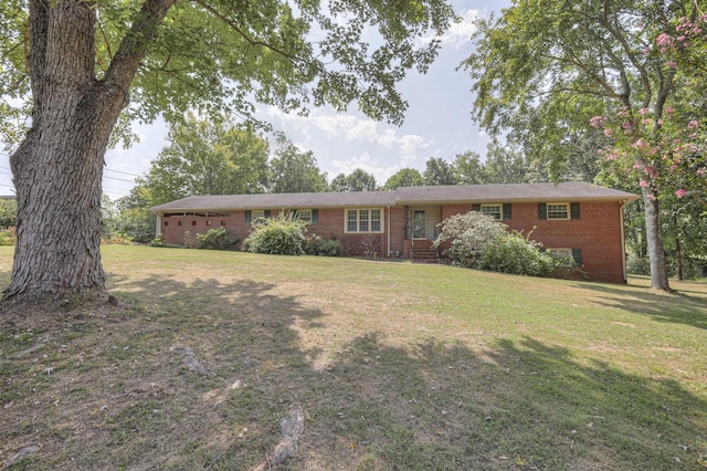 ranch-style home featuring a front yard and brick siding