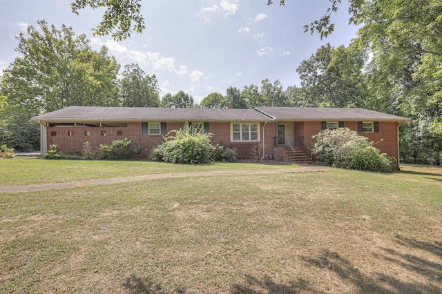 single story home featuring a front lawn and brick siding