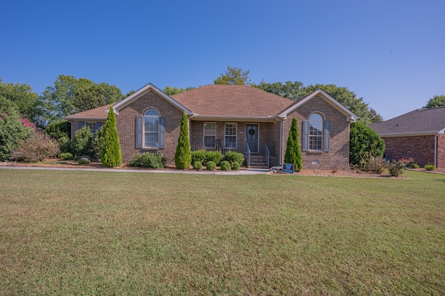 ranch-style home with a front yard