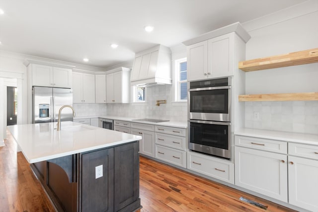 6816 Springwater St, Smyrna, TN 37167 - kitchen with appliances with stainless steel finishes, a sink, decorative backsplash, light countertops, and recessed lighting
