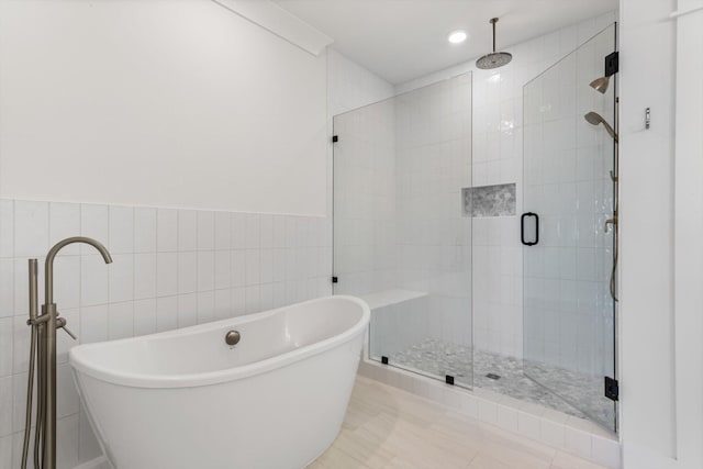 6816 Springwater St, Smyrna, TN 37167 - bathroom featuring a stall shower, a freestanding bath, tile walls, and recessed lighting