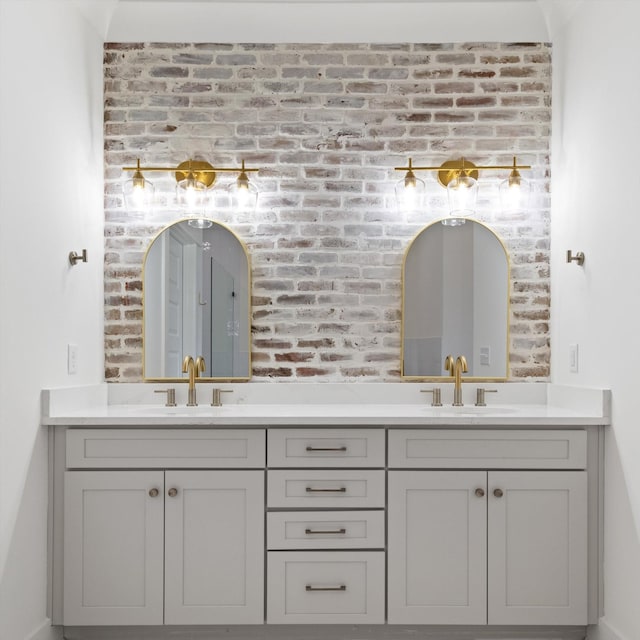 6816 Springwater St, Smyrna, TN 37167 - bathroom featuring brick wall and double vanity
