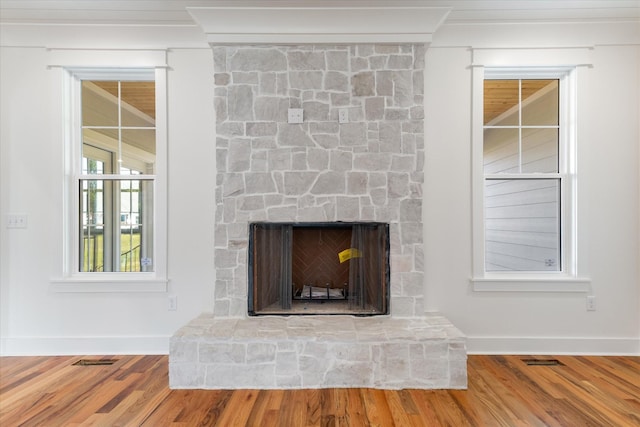 6816 Springwater St, Smyrna, TN 37167 - detailed view of baseboards, wood finished floors, ornamental molding, and a fireplace