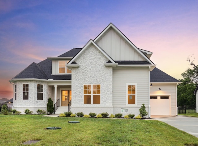 6816 Springwater St, Smyrna, TN 37167 - view of front of property featuring board and batten siding, driveway, a garage, stone siding, and a front yard