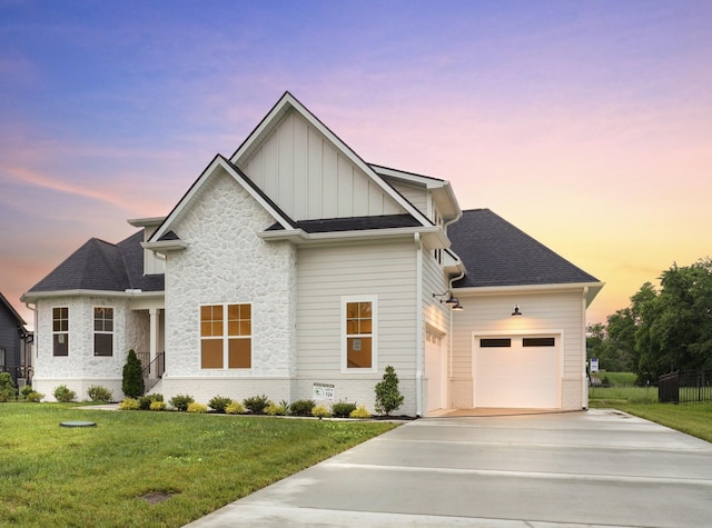 6816 Springwater St, Smyrna, TN 37167 - view of front of home featuring driveway, board and batten siding, a garage, a front lawn, and stone siding