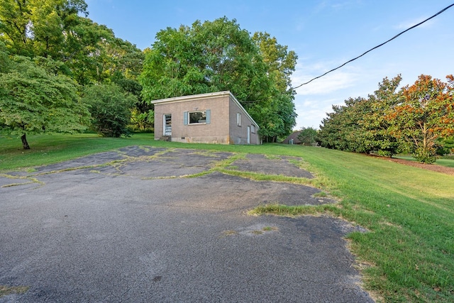 garage featuring a yard