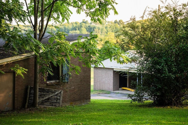 rear view of property featuring a lawn