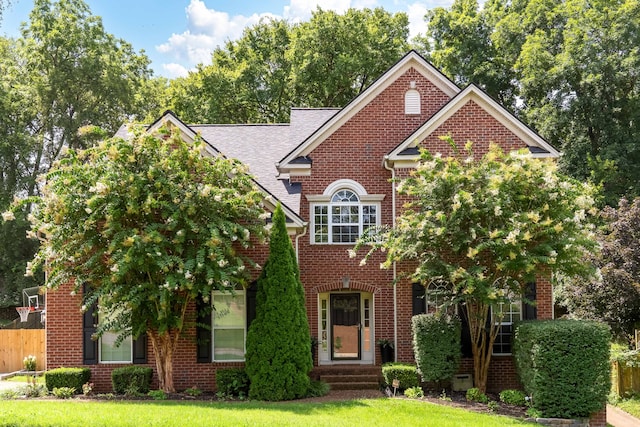 view of front of home with a front lawn