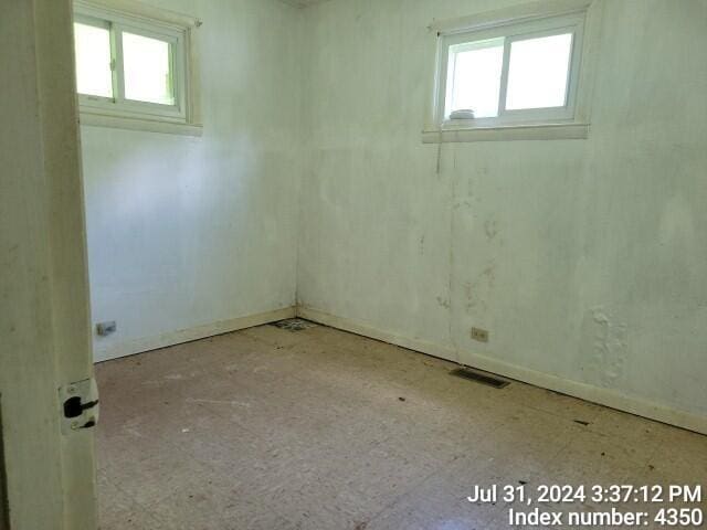 basement with visible vents and a wealth of natural light