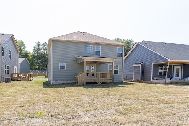 rear view of house featuring a wooden deck, ceiling fan, a yard, and central AC unit