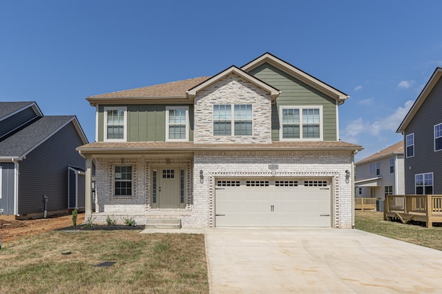 view of front facade with a garage and a front yard