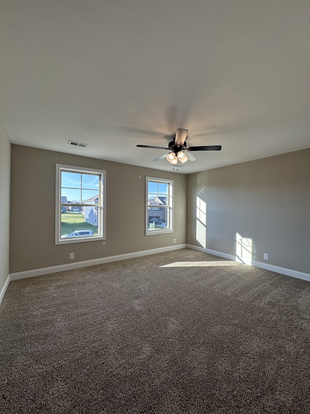 carpeted empty room with ceiling fan