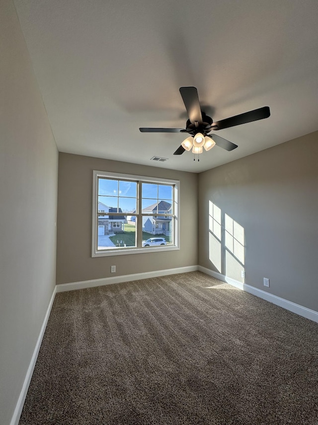 unfurnished room with carpet and ceiling fan