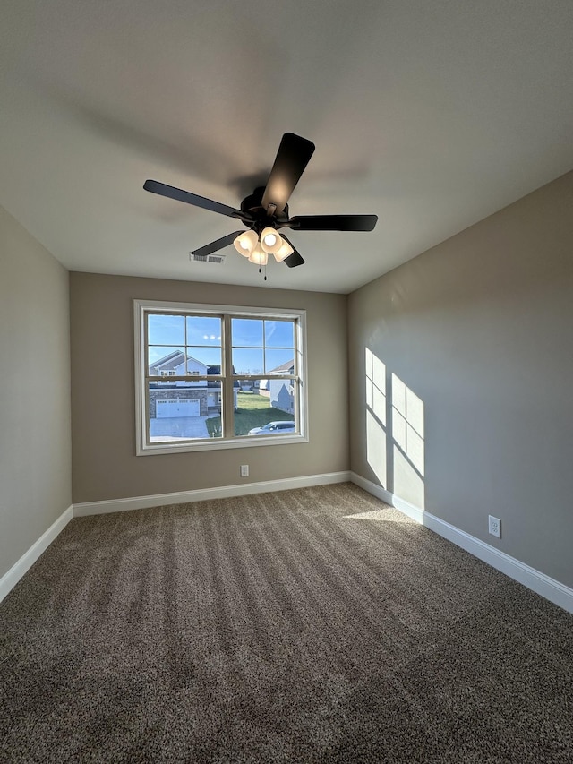 unfurnished room with carpet flooring and ceiling fan