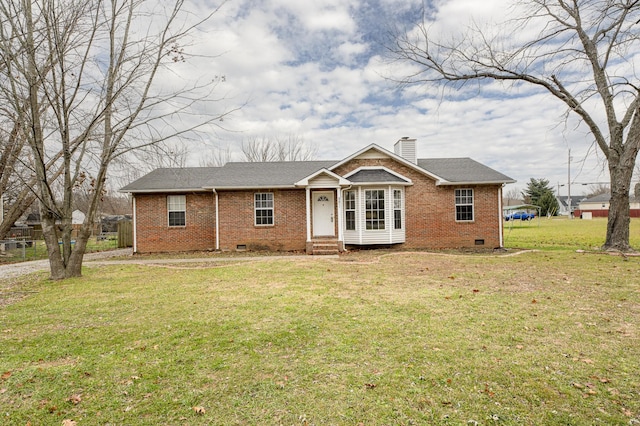 ranch-style home with a front lawn