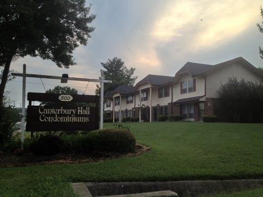 community sign with a lawn