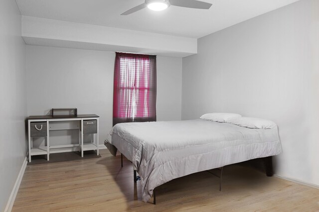 bedroom featuring ceiling fan and hardwood / wood-style flooring