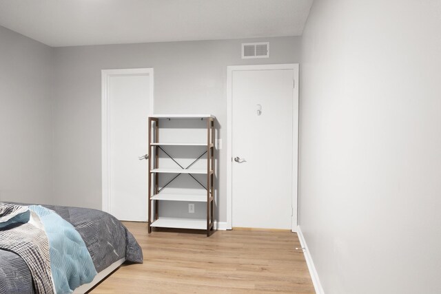 bedroom with light hardwood / wood-style flooring