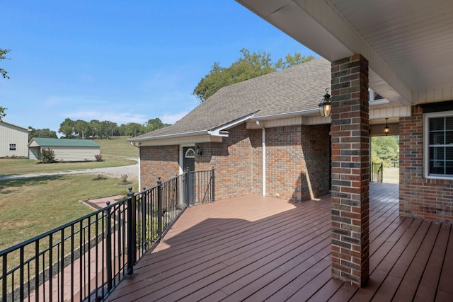 wooden deck with a yard