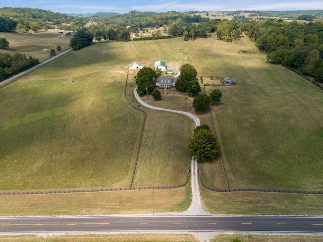 birds eye view of property with a rural view