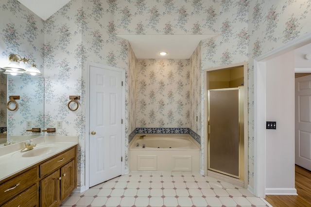 bathroom with vanity, separate shower and tub, and hardwood / wood-style flooring