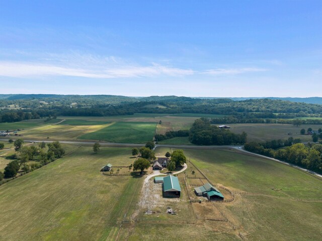 birds eye view of property with a rural view