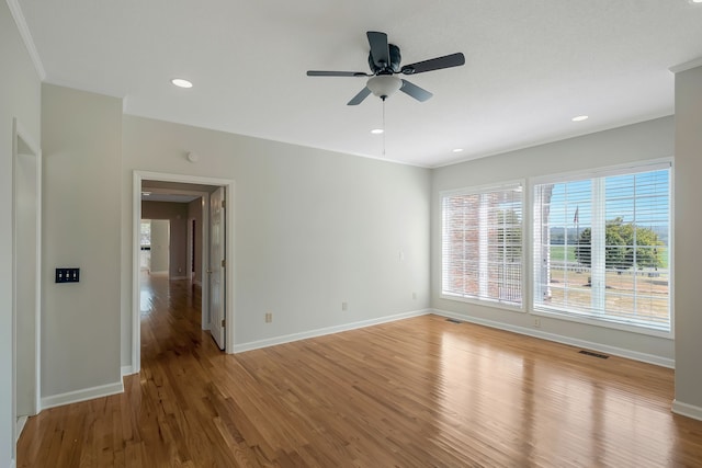 empty room with wood-type flooring and ceiling fan