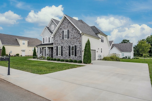 view of front facade featuring a garage and a front lawn