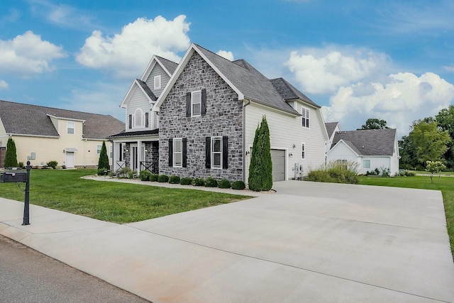 view of front facade with driveway, stone siding, a garage, and a front lawn