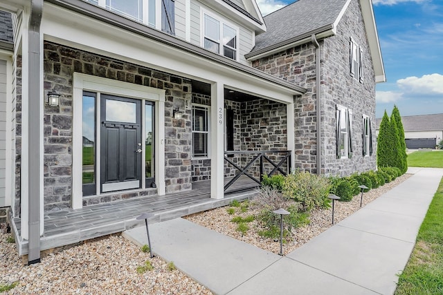 property entrance featuring a porch