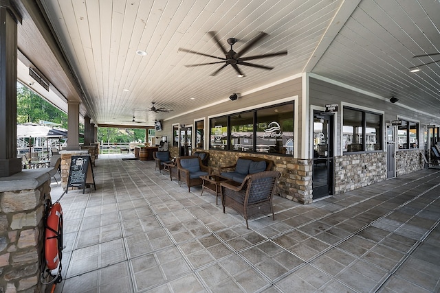 view of patio featuring ceiling fan