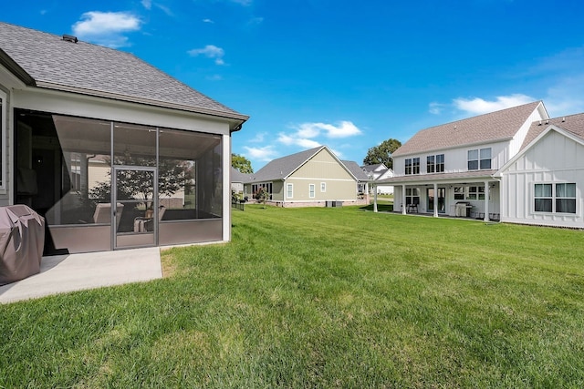 view of yard with a sunroom