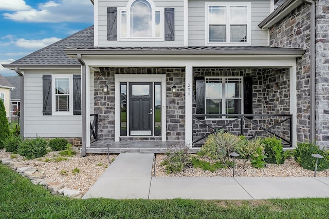 doorway to property with a porch