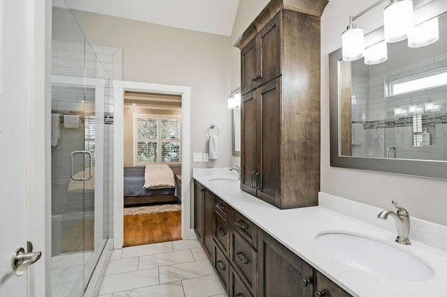 bathroom with vanity, a healthy amount of sunlight, hardwood / wood-style floors, and an enclosed shower