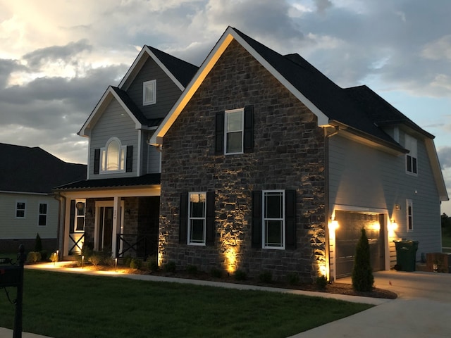 view of front of house featuring a garage and a front yard