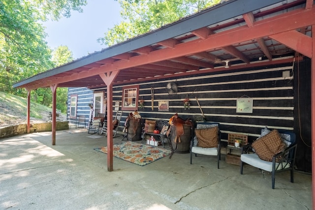 view of patio / terrace with an outbuilding