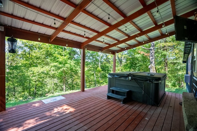 wooden terrace with a hot tub