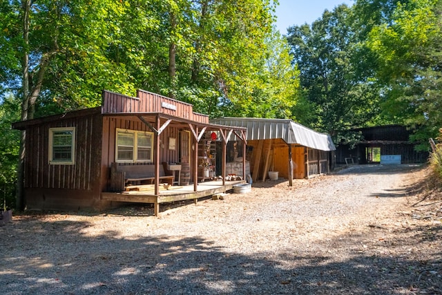 view of front of property with an outbuilding and a porch