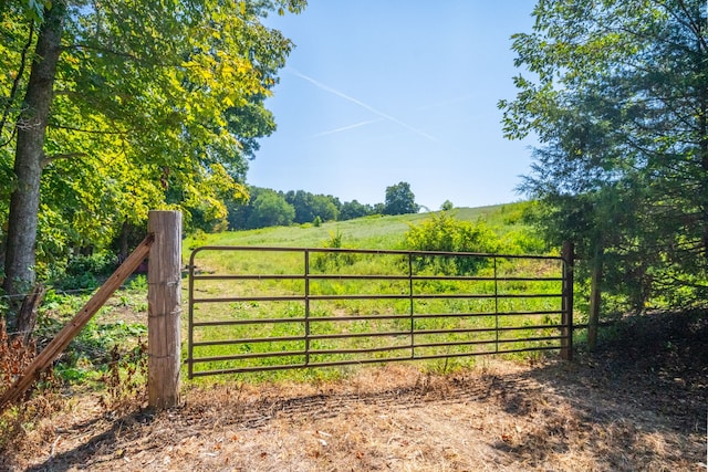 view of gate featuring a rural view