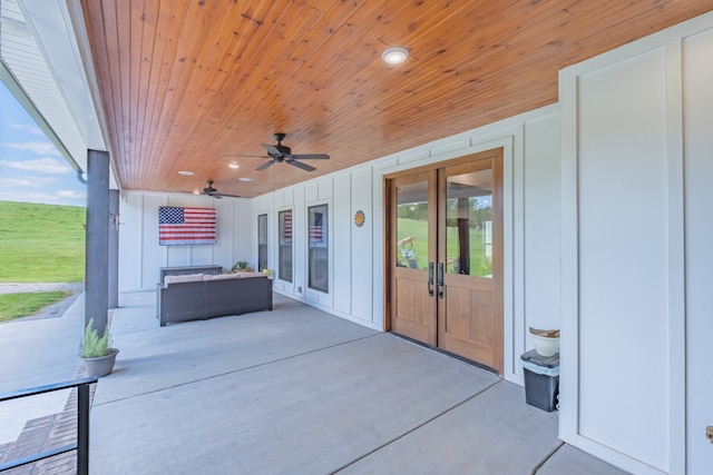 view of patio featuring ceiling fan and french doors