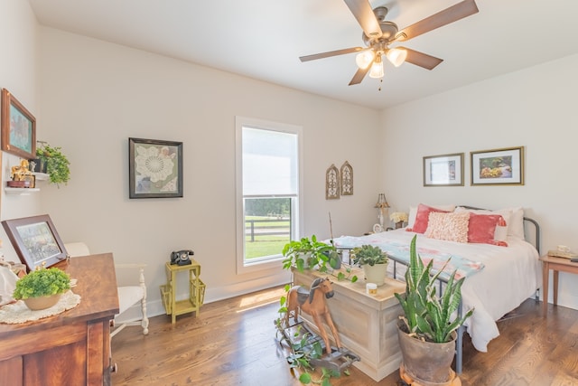 bedroom featuring dark wood-type flooring and ceiling fan